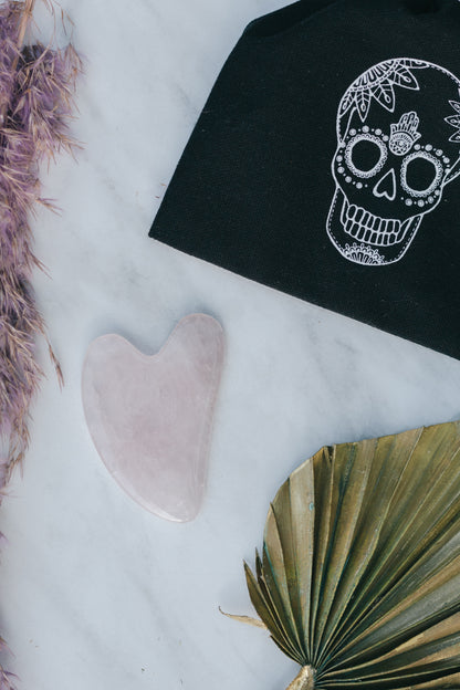 Rose Quartz Crystal Gua Sha with Black Skull Pouch